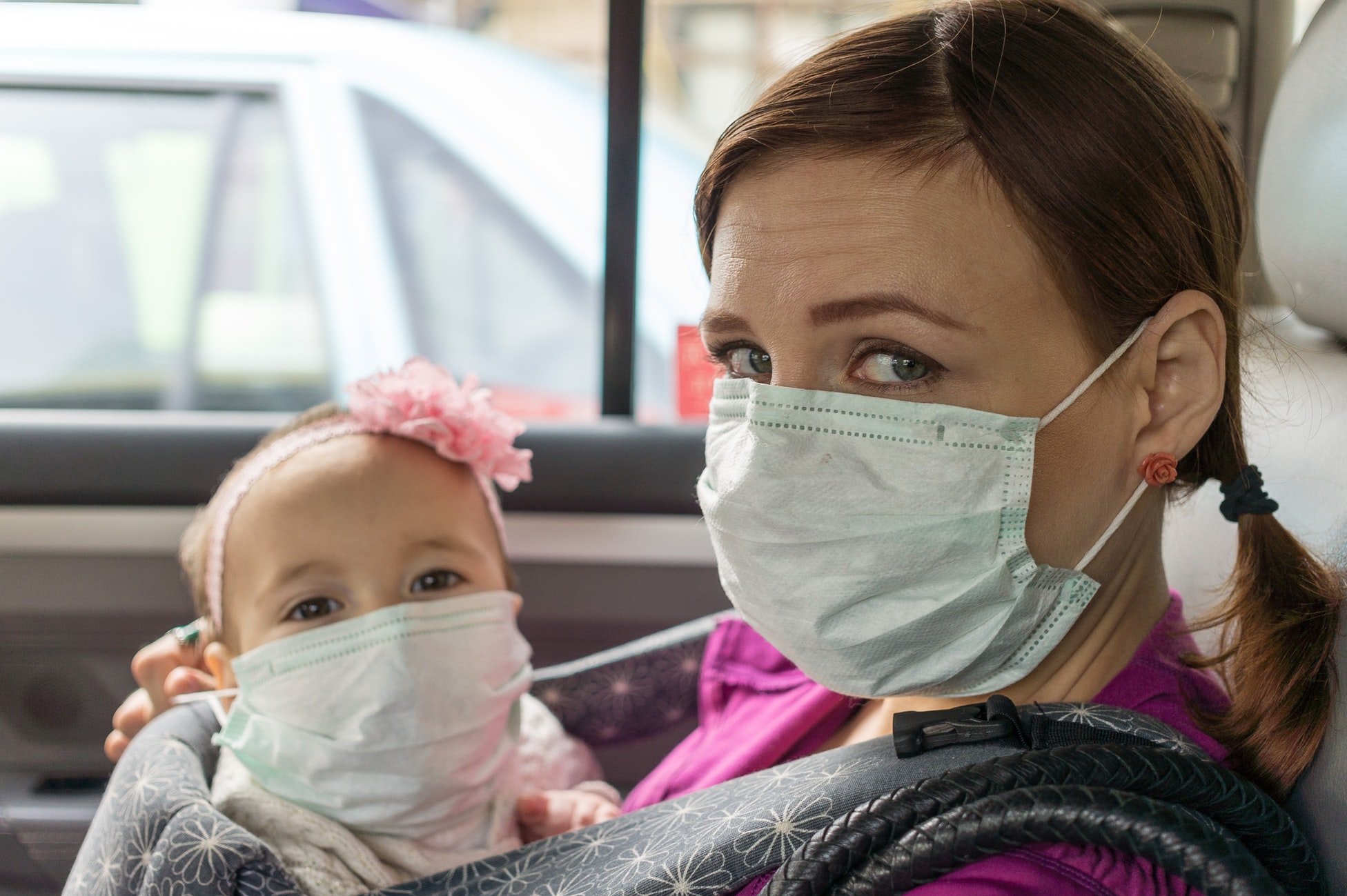 Woman and child with masks